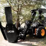 JCB 270W Skid Steer transporting tree.