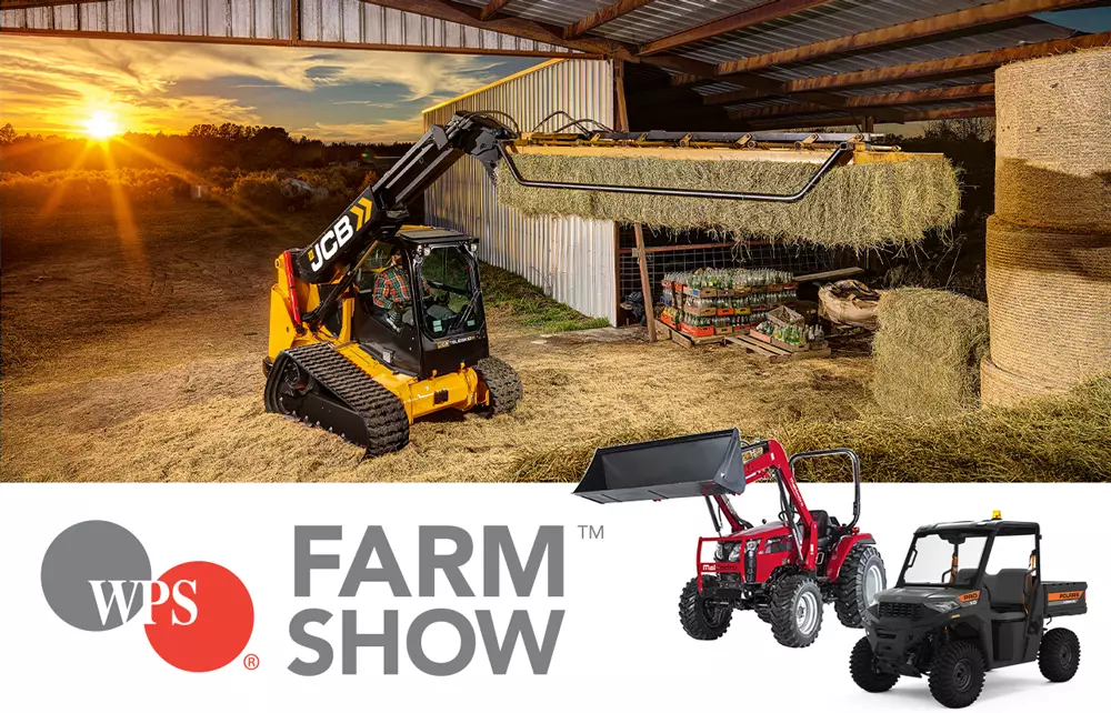 JCB skid steer lifting hay in a barn, Mahindra 2638 tractor, and Pro XD Mid-Size utility vehicle.