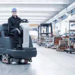 Advance SC5000 rider scrubber cleaning manufacturing facilities floors.