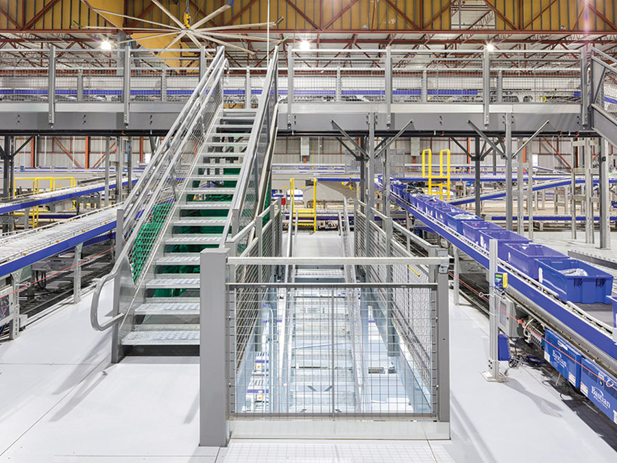 Mezzanine and safety rails in warehouse distribution center.