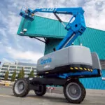 Genie S-60 J telescopic boom lift lifting people.