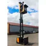 TASK Sidewinder task support vehicle outdoors, lifting operator up.