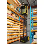 TASK Sidewinder vehicle lifting operator to top shelf in a warehouse.