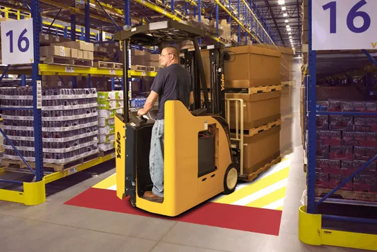 Yale Reliant slowing the truck down at a warehouse aisle intersection.