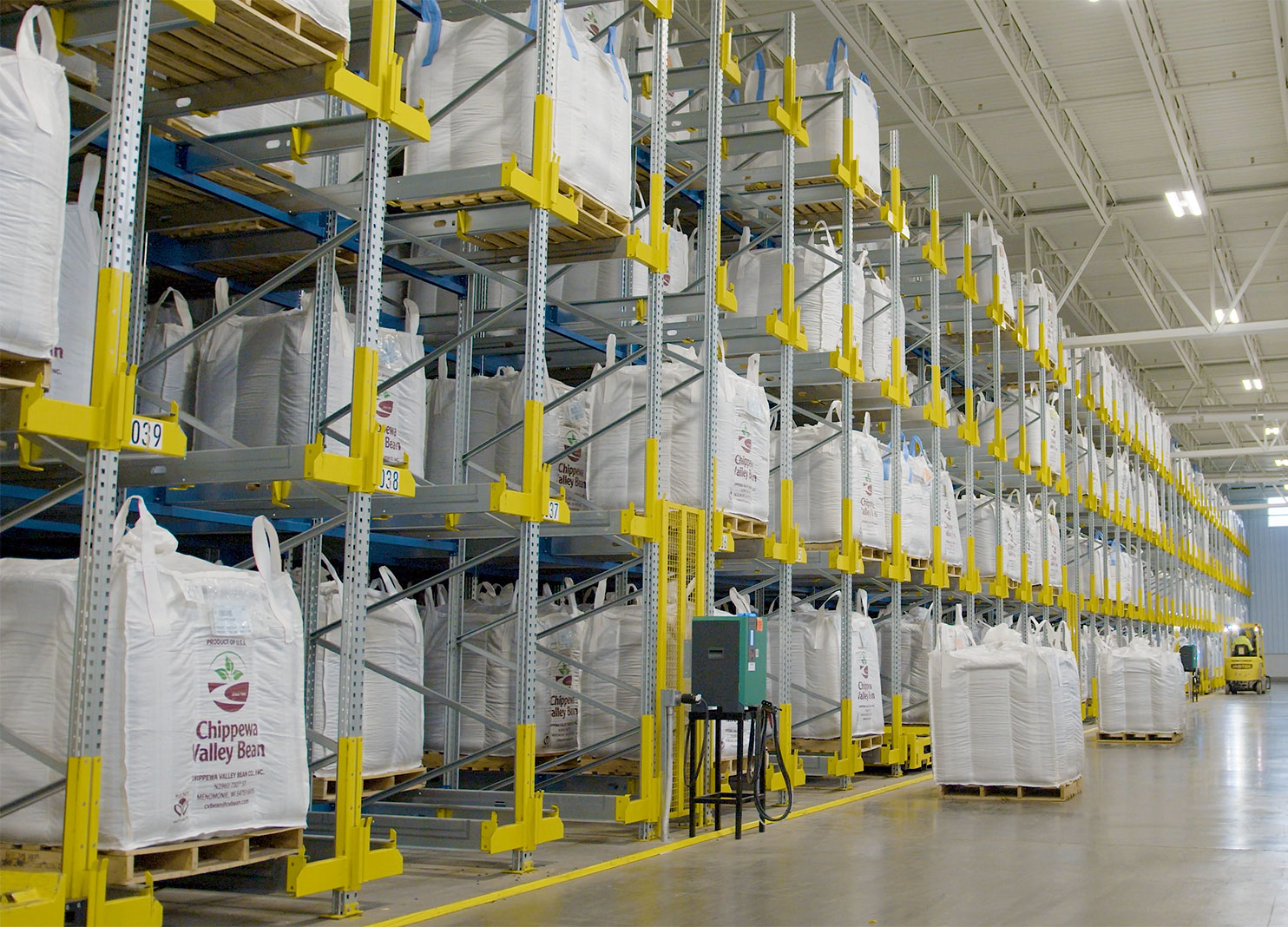 Chippewa Valley Bean kidney bean totes stacked in pallet shuttle racking system.