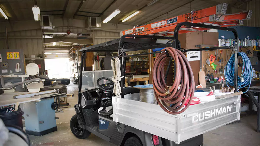 Cushman Hauler 1200 Utility Vehicle with loaded cargo bed.