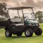 Cushman Hauler 800X Utility Vehicle near hill on golf course.
