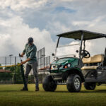 Cushman Hauler Pro utility vehicle in a field.