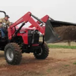 Mahindra 4550 4WD Tractor with dirt in bucket loader attachment.