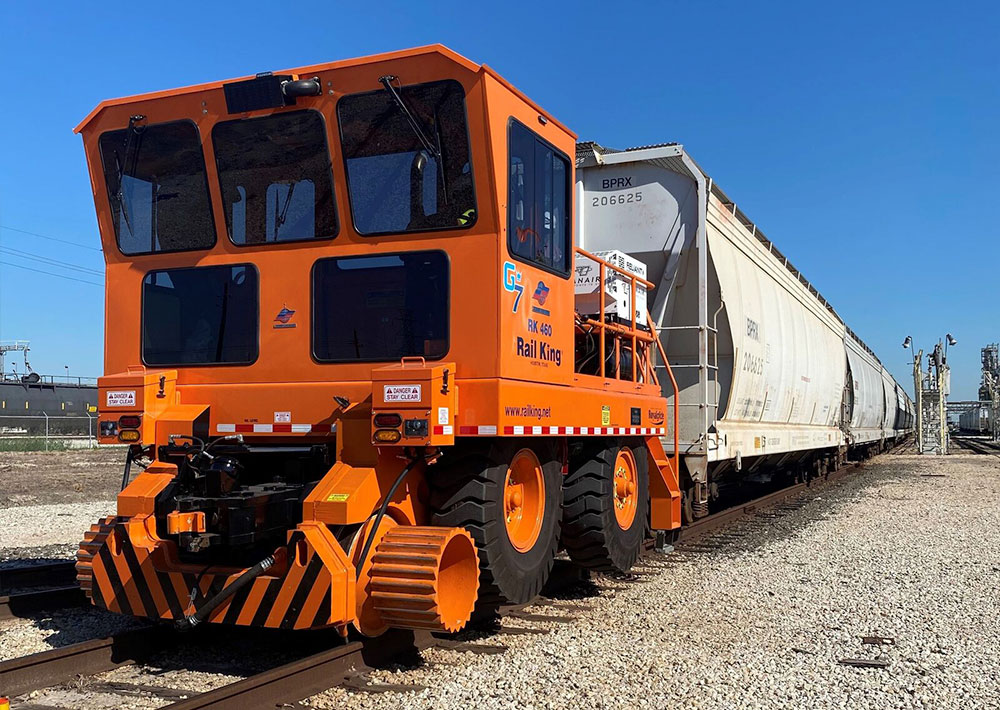 Rail King RK460 G7 mobile railcar mover moving many railcars.