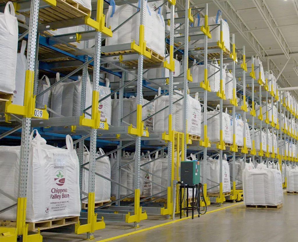 Chippewa Valley Bean kidney bean totes stacked in pallet shuttle racking system.