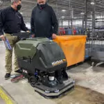 Kodiak K16 scrubber with disk deck in apparel warehouse facility.