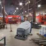 Advance SC800 cylinder scrubber cleaning manufacturing facility floors.