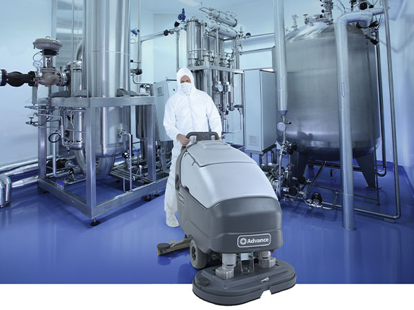 Advance SC800 walk-behind scrubber cleaning in chemical room.
