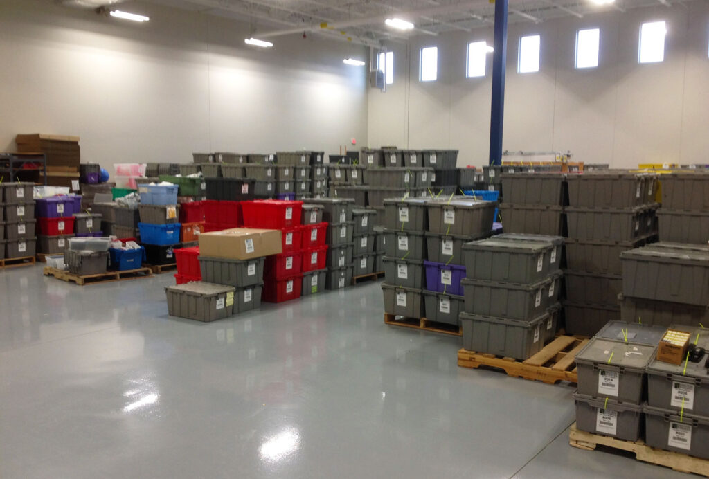 Bins stacked on the floor.