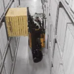 Bendi B30AC narrow aisle forklift in a warehouse aisle.