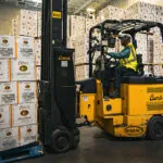Bendi B40AC warehouse forklift with pallet of Titos vodka.
