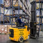 Bendi B40AC forklift driving in warehouse.