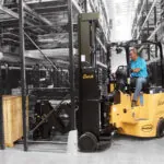 Bendi B40AC-DR forklift in warehouse aisle.