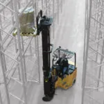 Bendi B40AC-HL narrow aisle forklift placing pallet on warehouse racking.