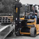 Drexel R60i5 lift truck raising steel beams.