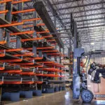 Drexel SL50AC forklift in warehouse with cantilever racking.