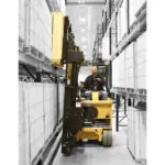 Drexel SLT30AC electric forklift placing pallet on warehouse racking.