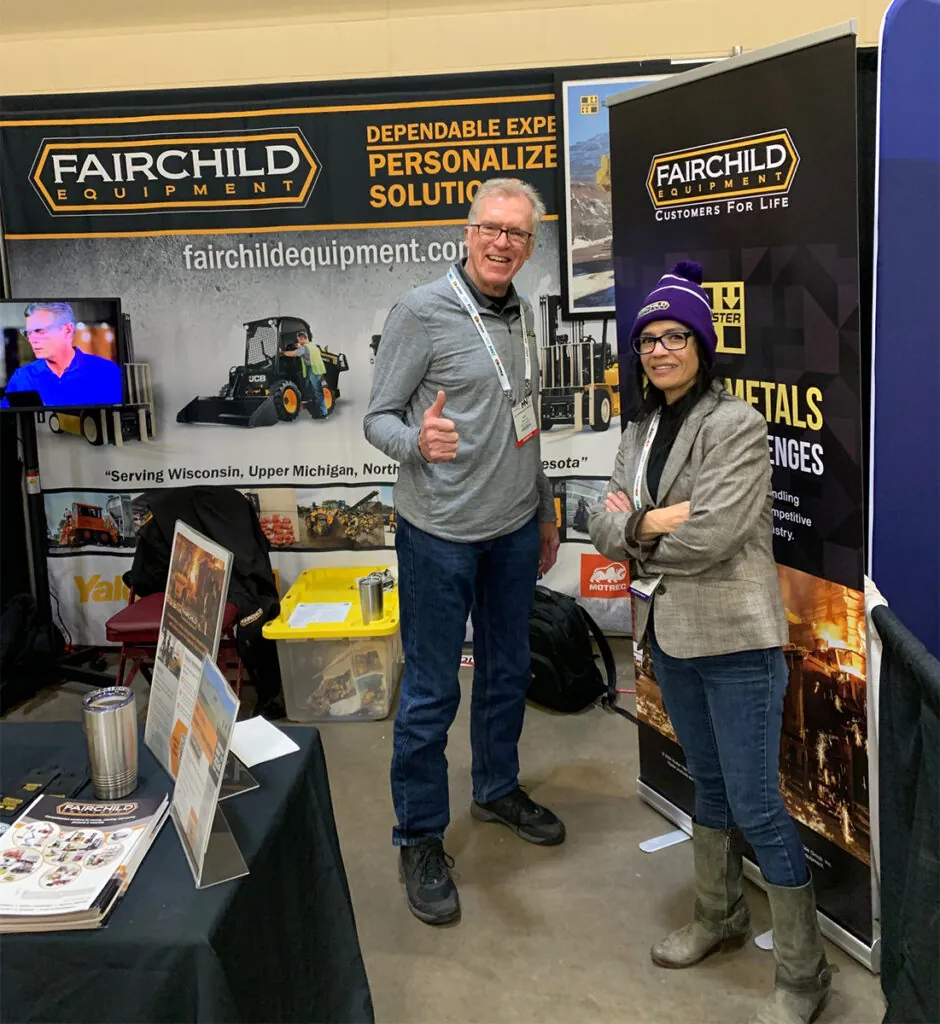 Fairchild Equipment salesman, Bob Koch, and event attendee at Fairchild Equipment SME Duluth, MN show booth.