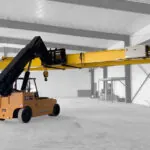 Landoll PT40 telehandler transporting building beams.