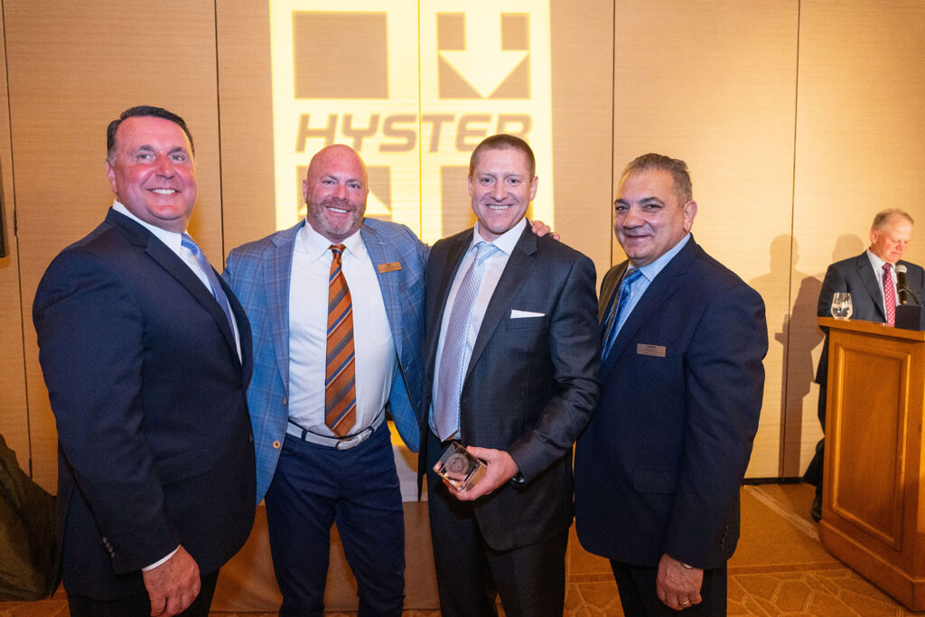 Fairchild Equipment President, Van Clarkson, and CEO, Chad Fairchild, accepting Hyster Dealer of Distinction award.