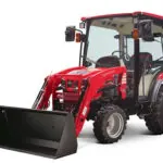 Mahindra 2100 Tractor with cab with bucket loader.