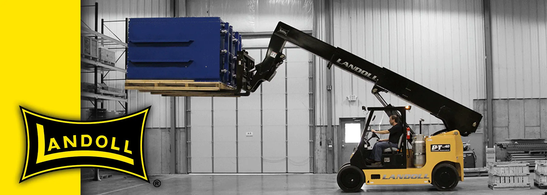 Landoll PT40 precision telehandler raising large pallet of materials inside a warehouse.