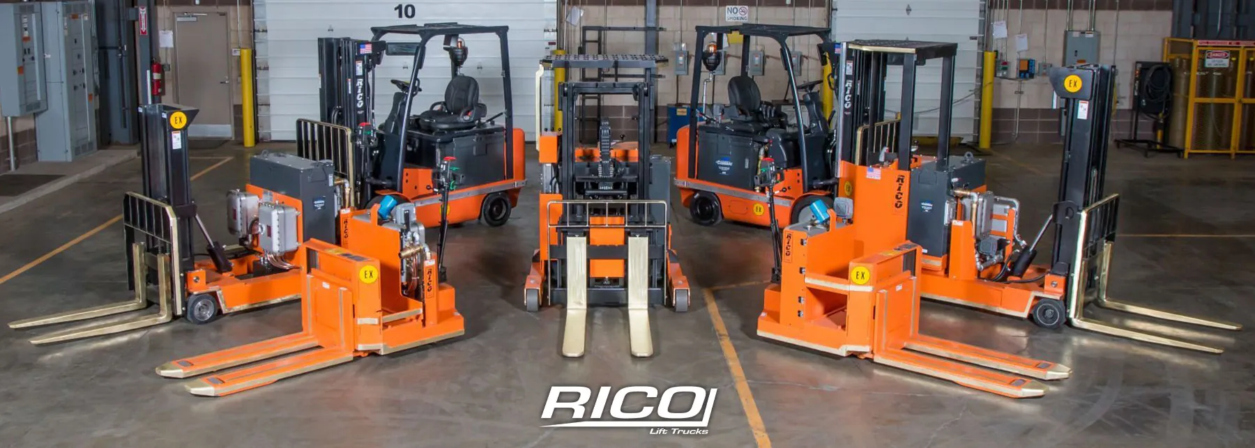RICO forklifts and pallet trucks in a garage.