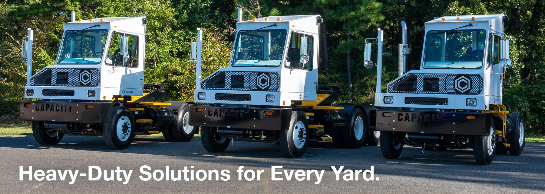 Capacity Yard Spotters in parking lot. "Heavy-Duty Solutions for Every Yard."