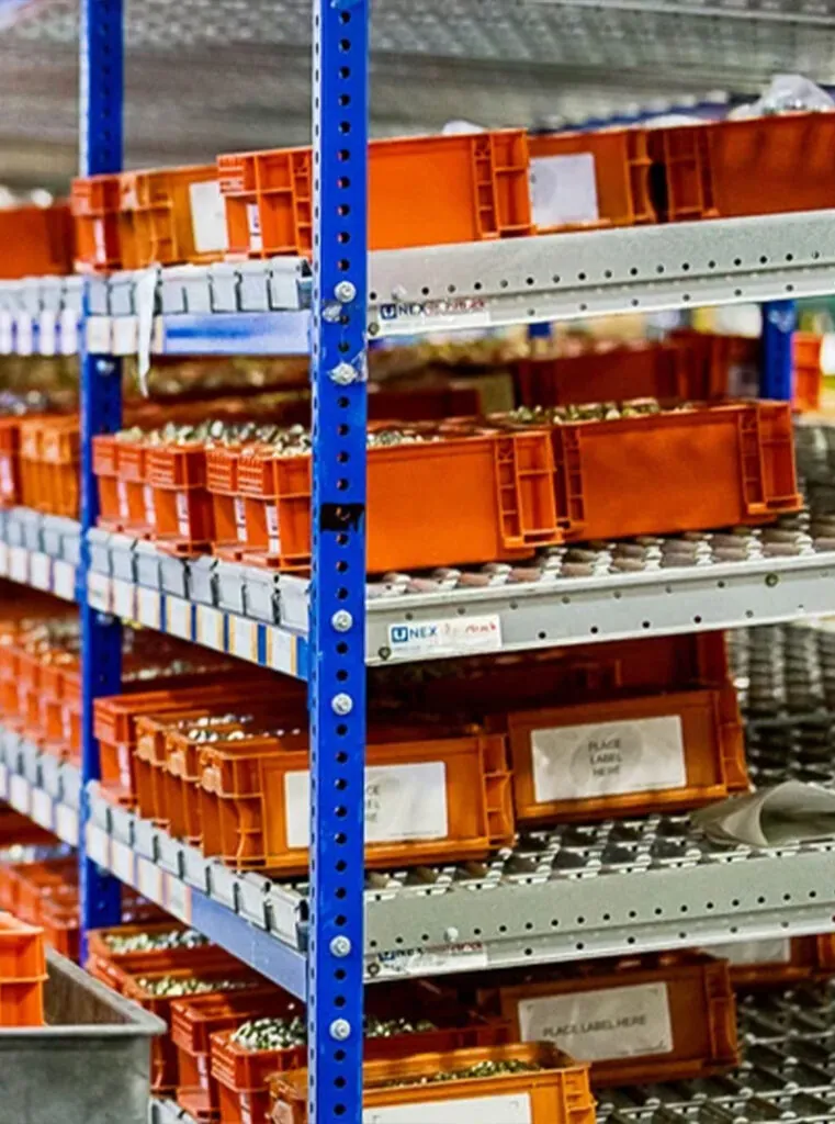 Containers on gravity flow racking.