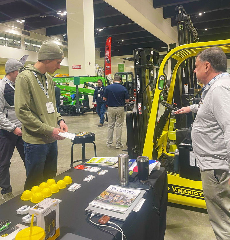 Doug Larsen, Director of Sales, conversing with Northern Green 2026 Show Attendees.