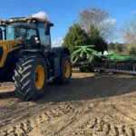 JCB 4220 Fastrac Icon agricultural tractor working on farm.