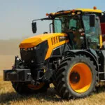 JCB 8330 Fastrac agricultural tractor on farm performing fieldwork.