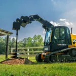 JCB 4TS-8T Teleskid drilling into dirt.
